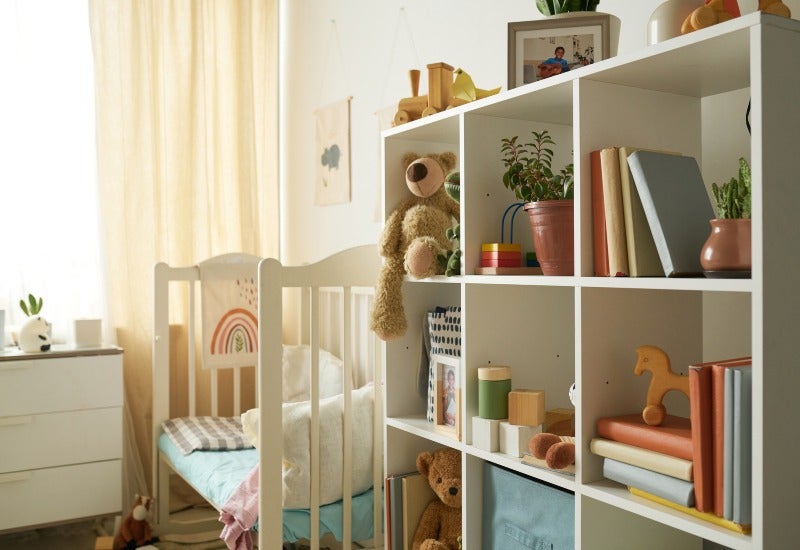 Baby’s room with crib, bookshelf, toys, showing benefits of using self-storage in Mountain View, CA