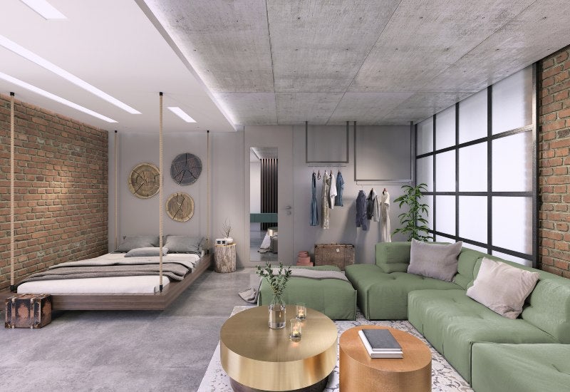 Modern studio with green couch & bed, showcasing efficient storage solutions in Mountain View, CA.