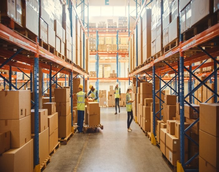 People handle boxes & pallets in the warehouse for Business Storage Solutions in Mountain View, CA.