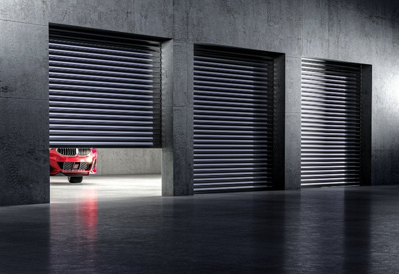 A red car is parked in a garage, showcasing secure car self-storage services in Mountain View, CA.
