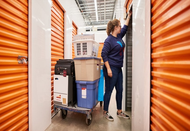 A Woman loads boxes into a climate-controlled personal storage unit in Mountain View, CA.