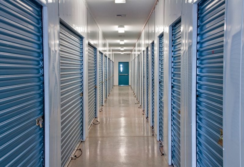 Indoor hallway with blue doors, showcasing climate-controlled storage units in Mountain View, CA.