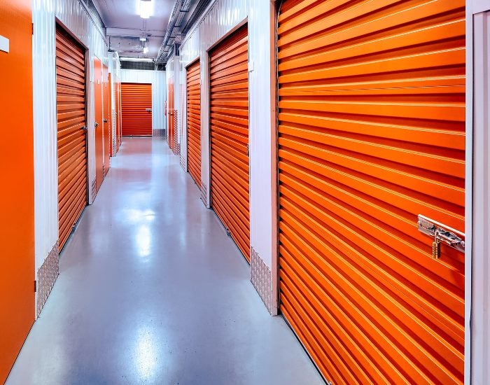 Orange storage units lined in a hallway, showcasing self-storage options in Mountain View, CA.