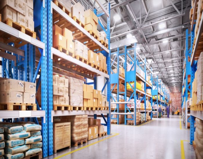 Warehouse in Mountain View, CA with shelves & boxes serves as storage units & functional workspaces.