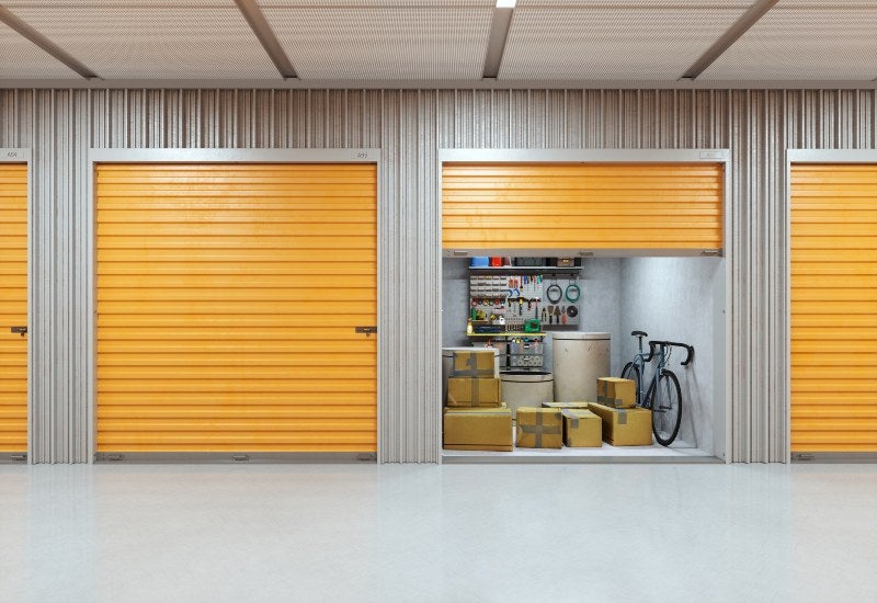 Storage facility with orange doors & floors, promoting renting a storage unit in Mountain View, CA