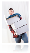 Boy moving storage boxes