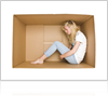 Girl sitting in storage box