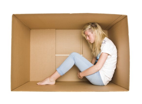 Girl sitting in storage box in Mountain View, CA